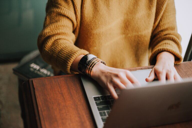 Woman sitting on a laptop