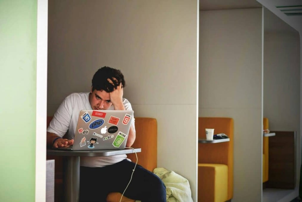 Man sitting stressed in library