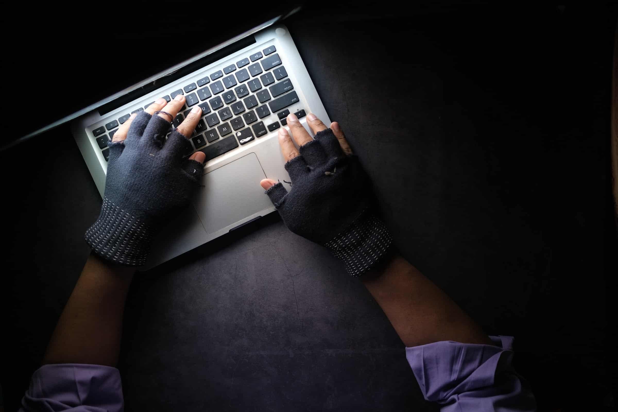 Economic Espionage - Man on a laptop